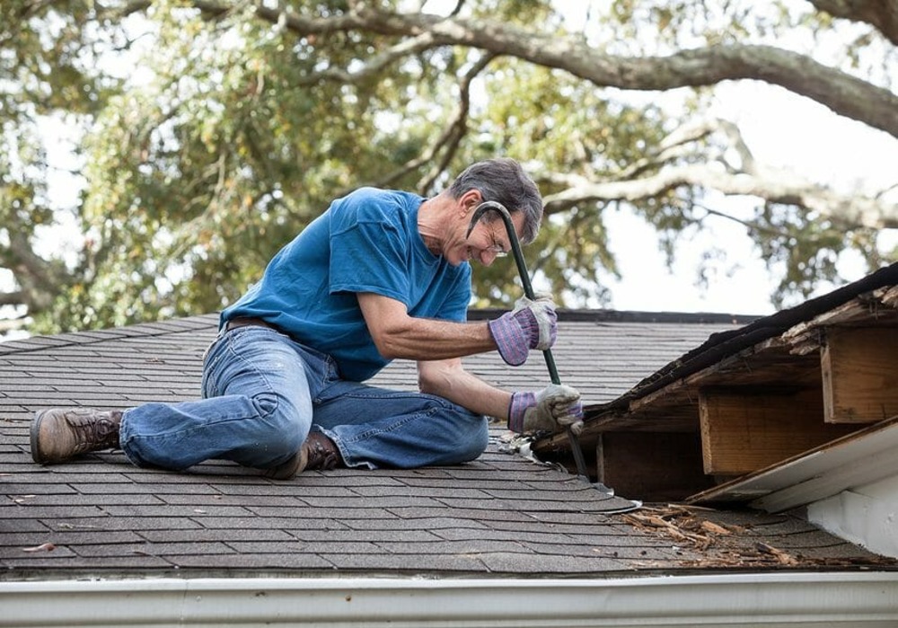 Roofer repairing a roof