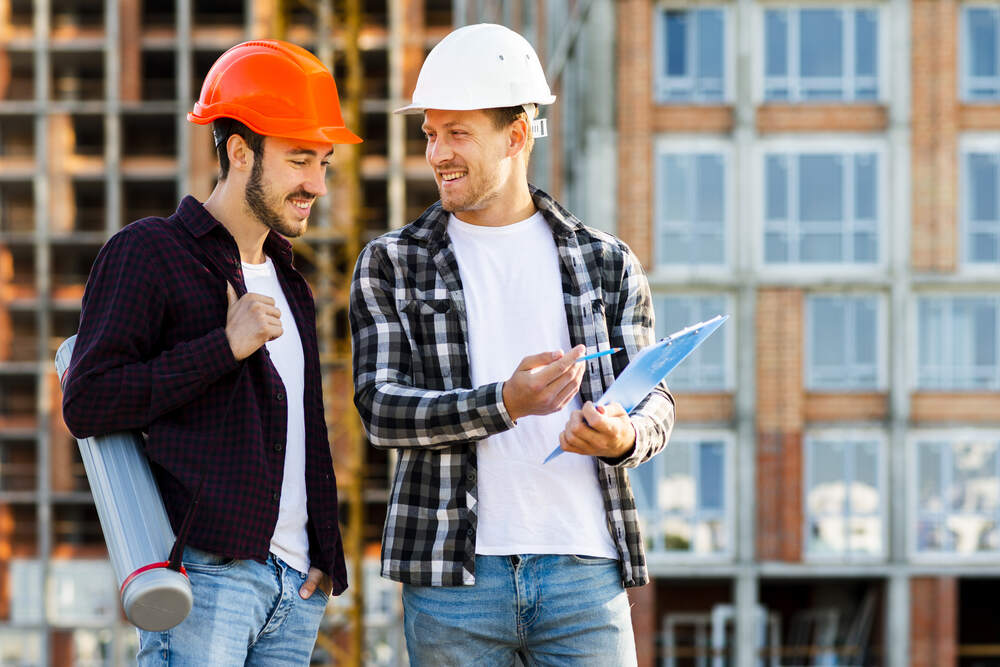 Contractor talking and planning on site
